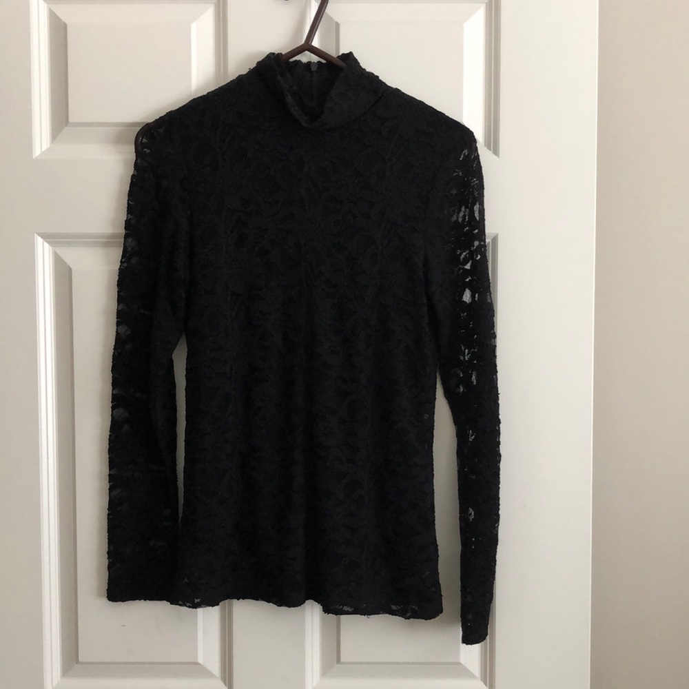 Chico’s black lace turtleneck with attached under garment.  See thru sleeves